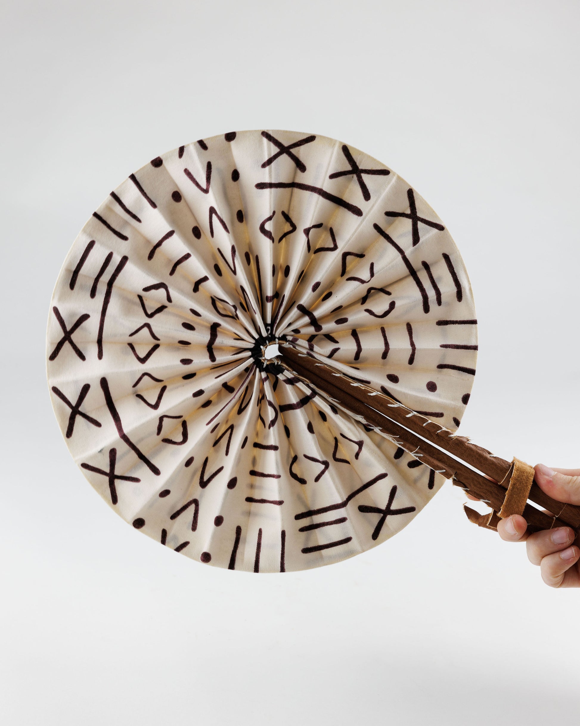 Fan - folds up for convenient storage, made out of African wax fabric