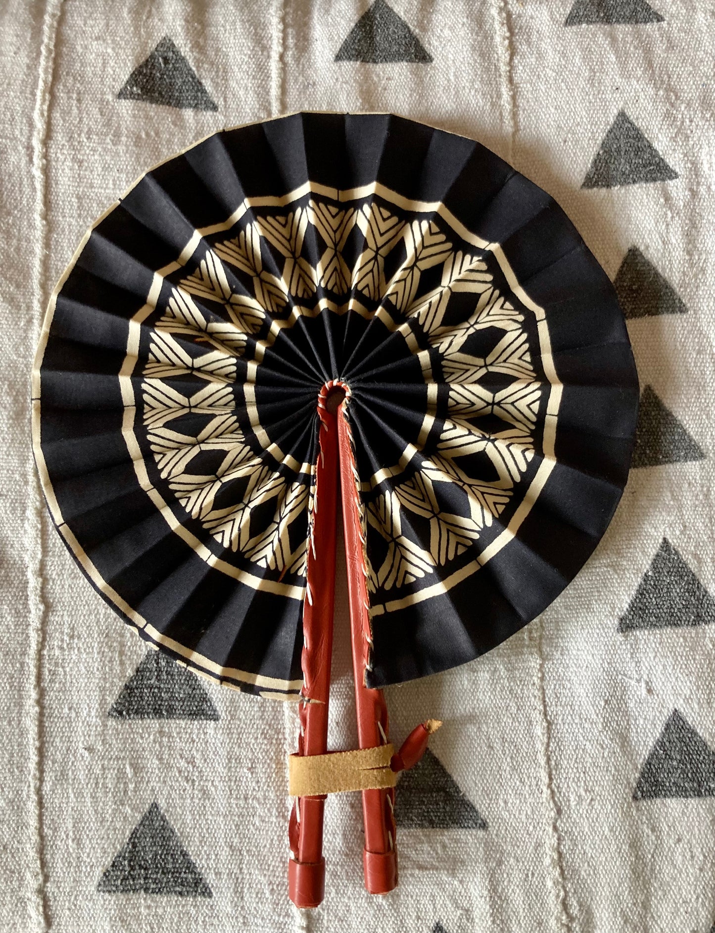 Fan- Collapses for easy storage, made from African wax fabric