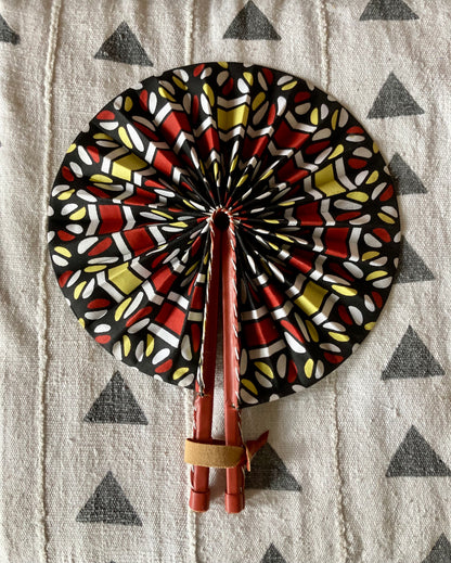 Fan- Collapses for easy storage, made from African wax fabric