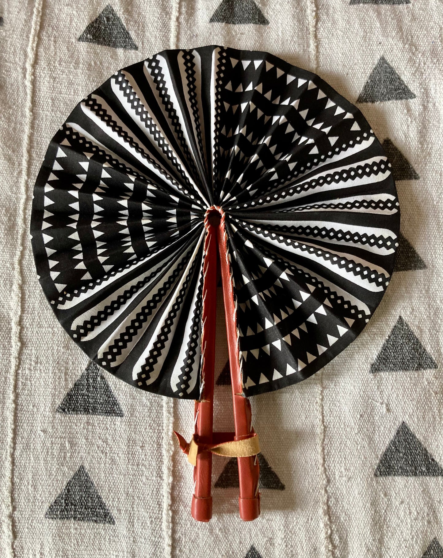 Fan- Collapses for easy storage, made from African wax fabric