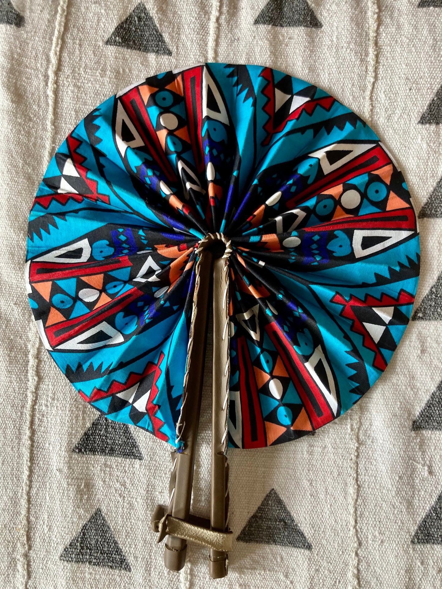 Fan- Collapses for easy storage, made from African wax fabric