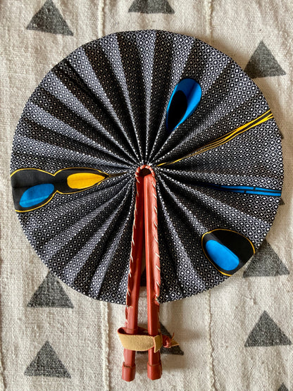 Fan- Collapses for easy storage, made from African wax fabric