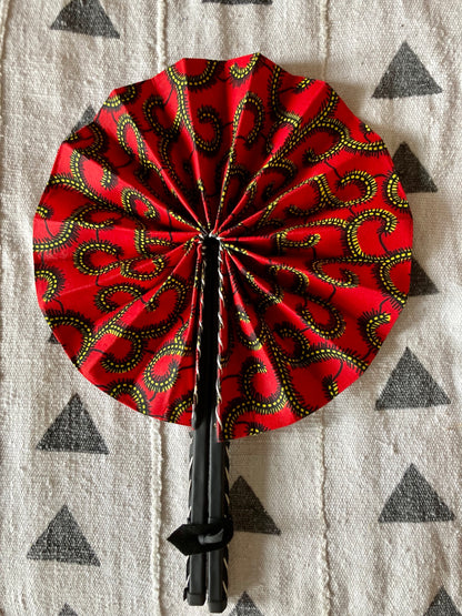 Fan- Collapses for easy storage, made from African wax fabric